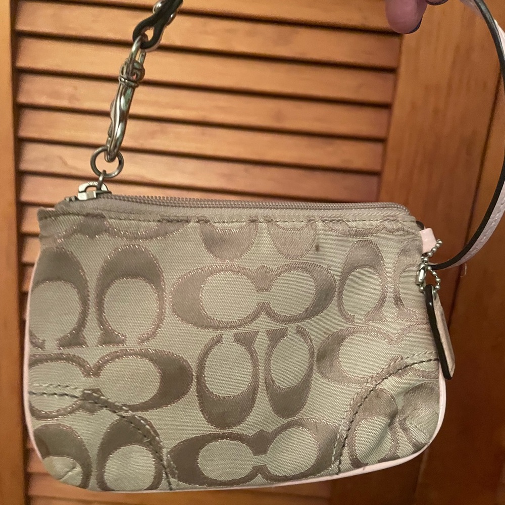 Coach pink and tan wristlet